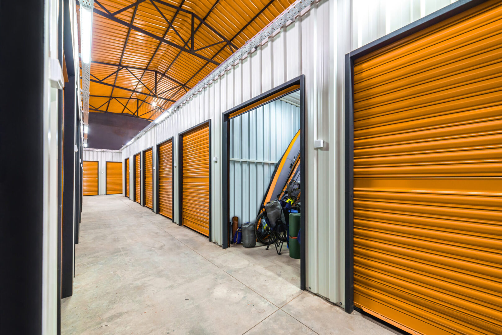 Corridor of self storage unit with yellow doors. Rental Storage Units Corridor of self storage unit with yellow doors. Rental Storage Units